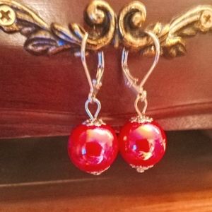 A pair of Cherry Red Pearl earrings